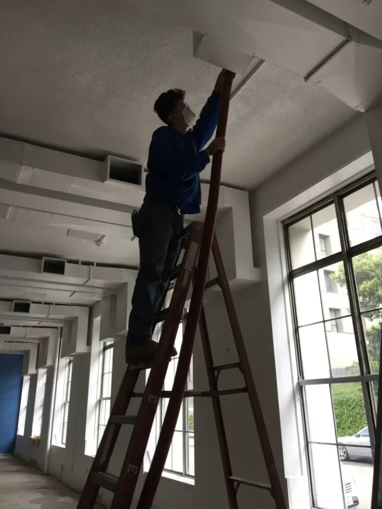 technician cleaning large commerncial duct system